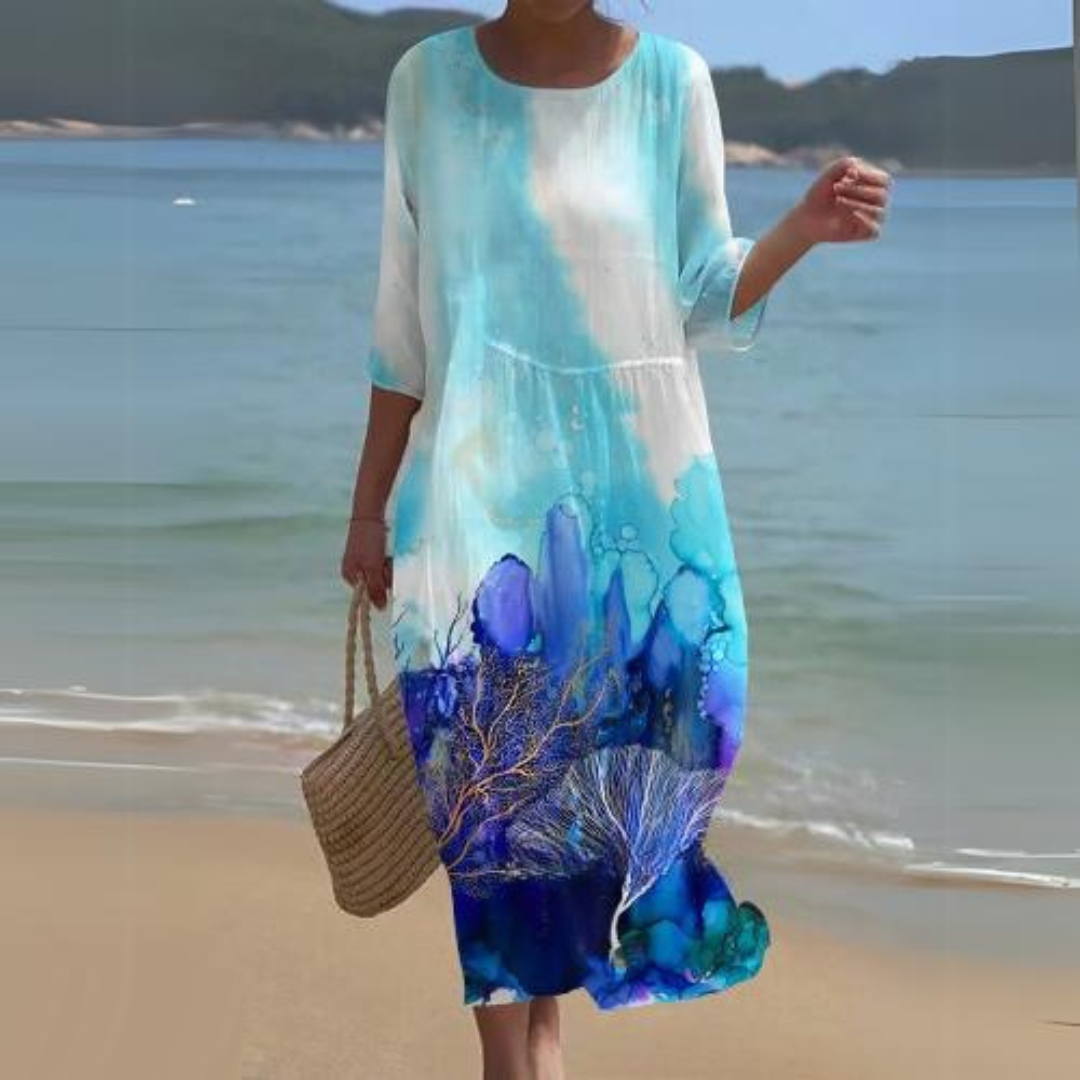 "Robe d'été midi fluide et élégante, idéale pour journées ensoleillées, en tissu léger offrant confort et style décontracté."