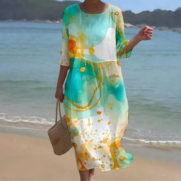 "Robe d'été midi fluide et élégante, idéale pour journées ensoleillées, en tissu léger offrant confort et style décontracté."