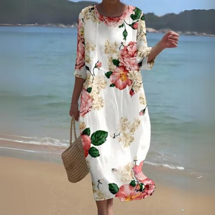 "Robe d'été midi fluide et élégante, idéale pour journées ensoleillées, en tissu léger offrant confort et style décontracté."