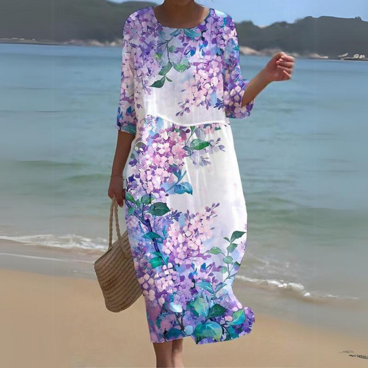 "Robe d'été midi fluide et élégante, idéale pour journées ensoleillées, en tissu léger offrant confort et style décontracté."