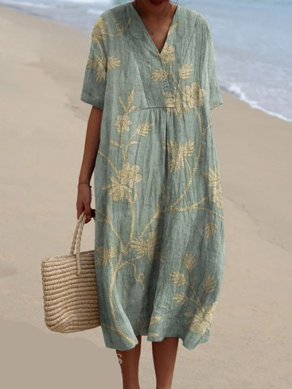 "Robe d'été Odile en coton-lin, motifs floraux, coupe élégante et confortable, idéale pour vos journées estivales."