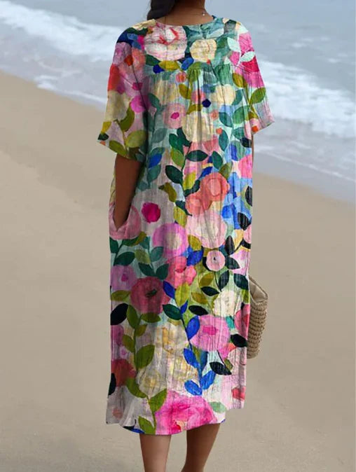 "Robe d'été Odile en coton-lin, motifs floraux, coupe élégante et confortable, idéale pour vos journées estivales."