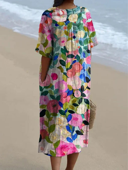 "Robe d'été Odile en coton-lin, motifs floraux, coupe élégante et confortable, idéale pour vos journées estivales."