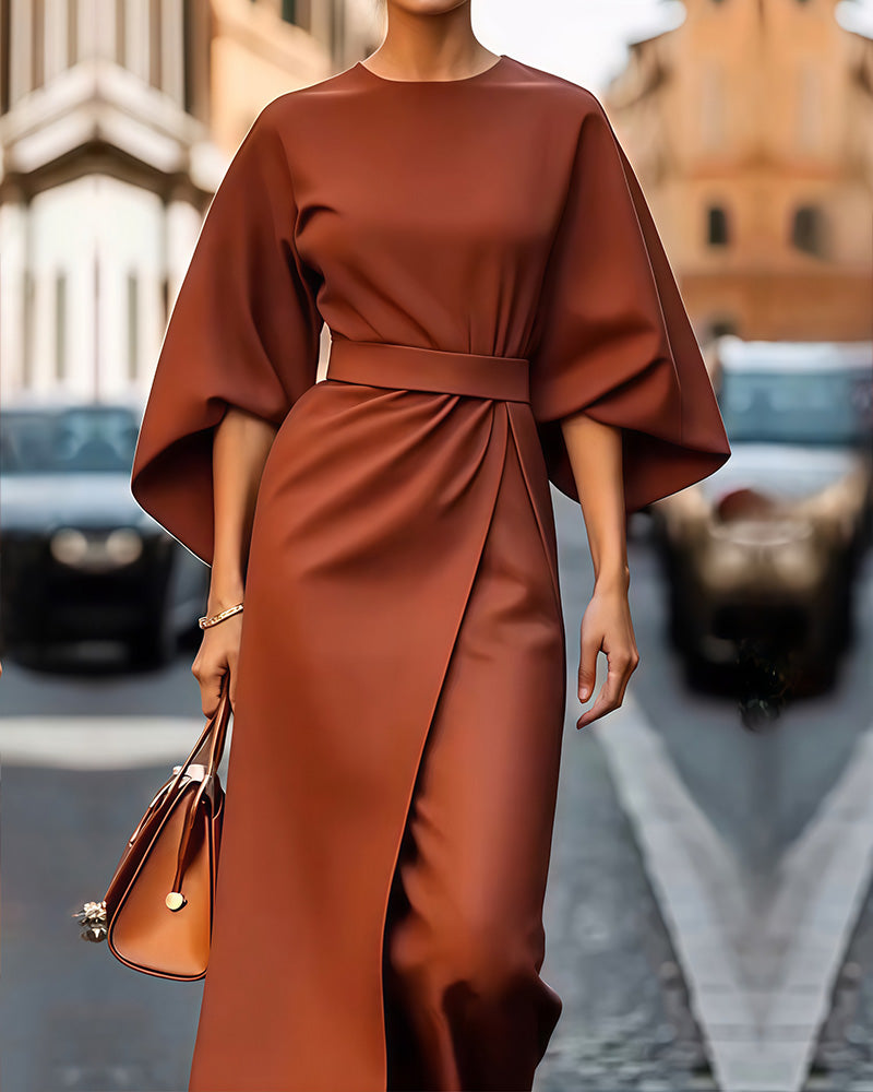 "Robe élégante avec manches lanternes chic et ceinture, idéale pour un look féminin et moderne lors d'occasions spéciales."