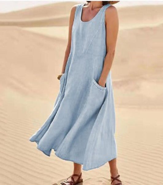 Robe élégante en coton beige, poches spacieuses, coupe fluide, idéale pour confort quotidien et élégance décontractée.