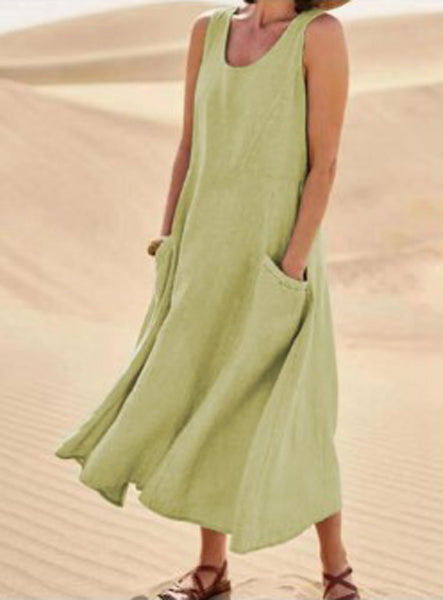 Robe élégante en coton beige, poches spacieuses, coupe fluide, idéale pour confort quotidien et élégance décontractée.