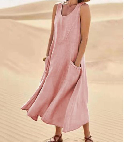 Robe élégante en coton beige, poches spacieuses, coupe fluide, idéale pour confort quotidien et élégance décontractée.