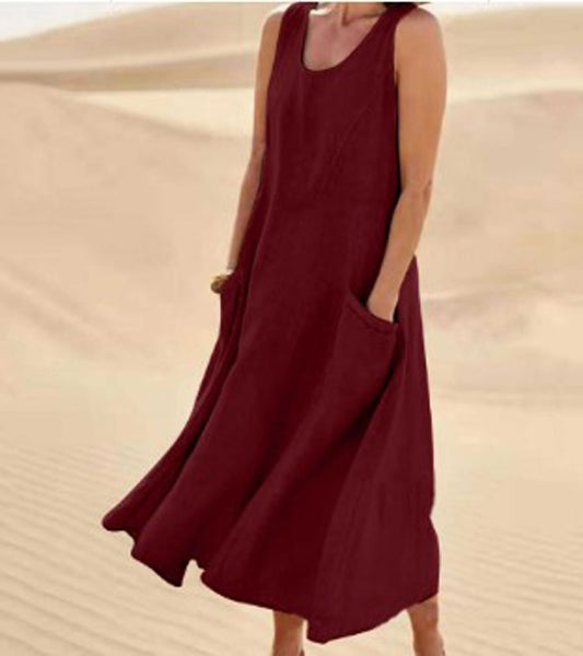 Robe élégante en coton beige, poches spacieuses, coupe fluide, idéale pour confort quotidien et élégance décontractée.