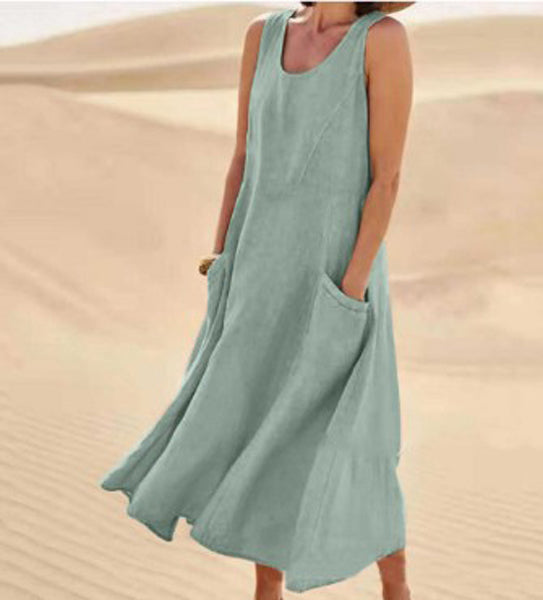 Robe élégante en coton beige, poches spacieuses, coupe fluide, idéale pour confort quotidien et élégance décontractée.