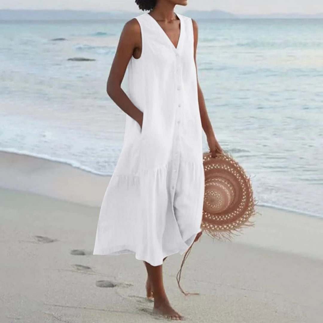 Robe en lin légère avec col en V flatteur, coupe élégante, idéale pour l'été. Parfaite pour toutes les occasions.
