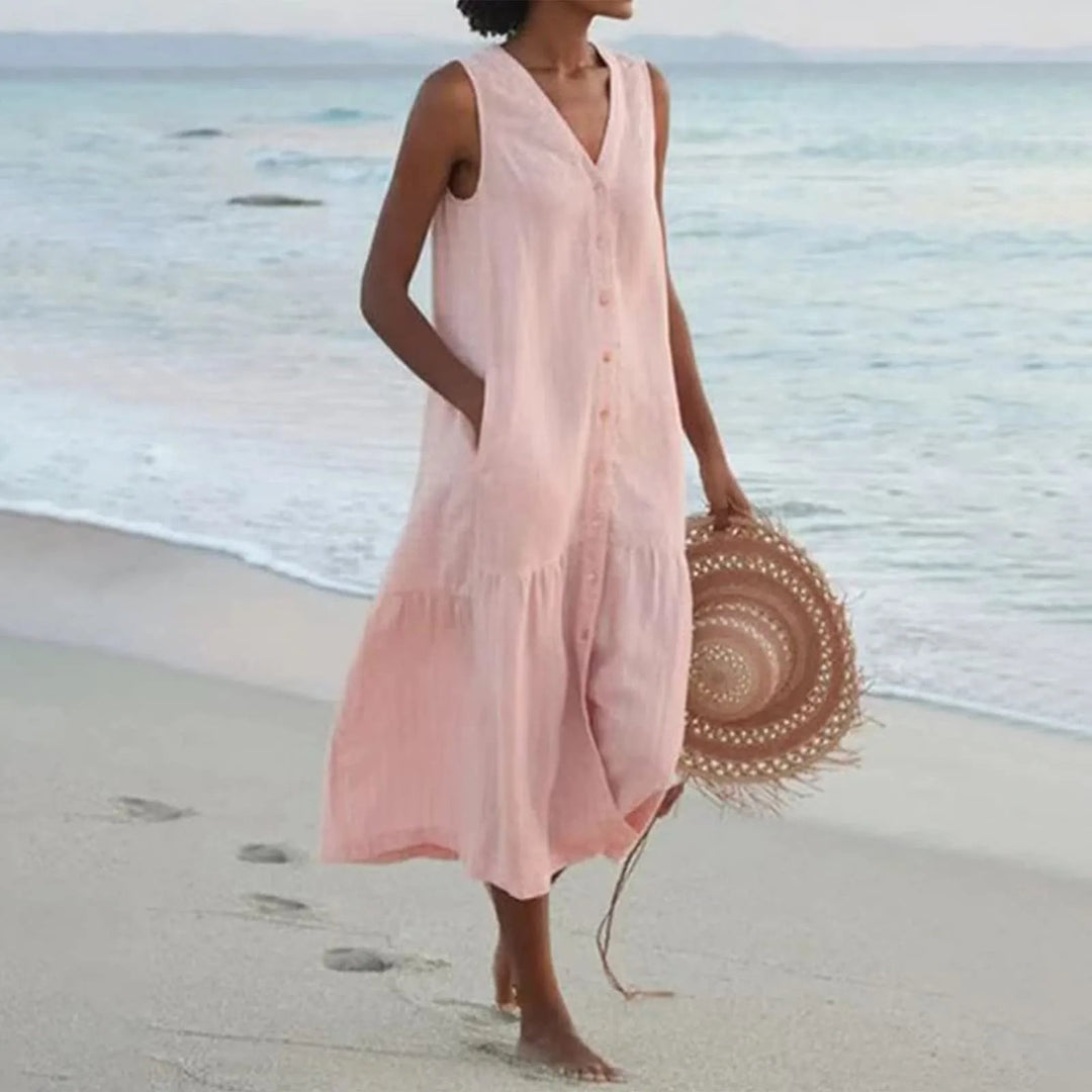 Robe en lin légère avec col en V flatteur, coupe élégante, idéale pour l'été. Parfaite pour toutes les occasions.