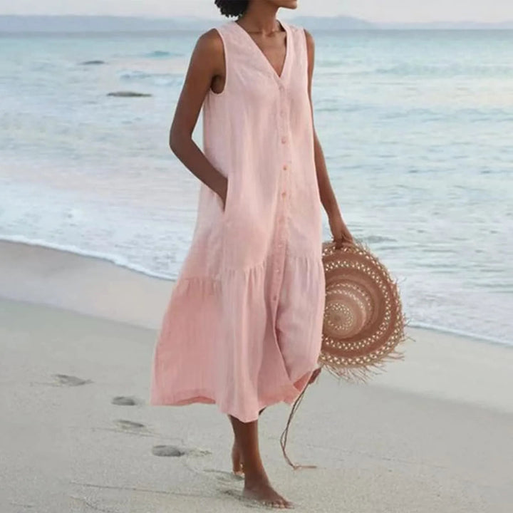 Robe en lin légère avec col en V flatteur, coupe élégante, idéale pour l'été. Parfaite pour toutes les occasions.