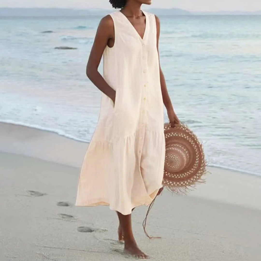 Robe en lin légère avec col en V flatteur, coupe élégante, idéale pour l'été. Parfaite pour toutes les occasions.