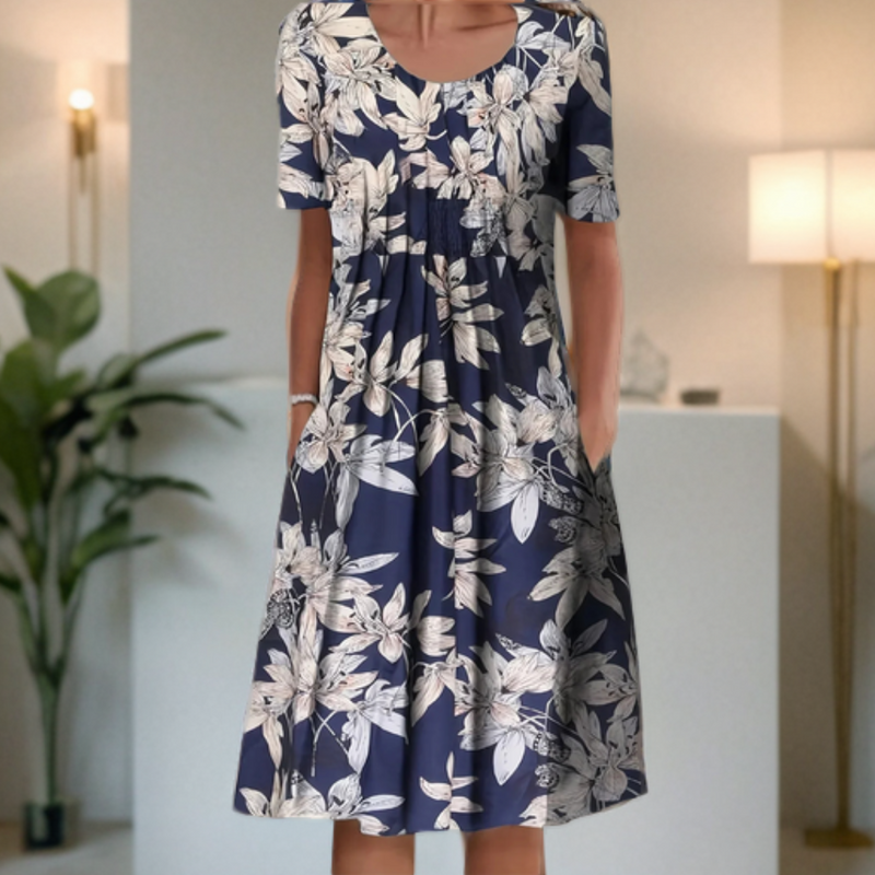 "Robe femme col rond, manches 3/4, imprimé moderne graphique, style chic, fluide et confortable pour un look décontracté."