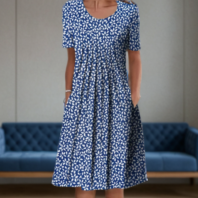 "Robe femme col rond, manches 3/4, imprimé moderne graphique, style chic, fluide et confortable pour un look décontracté."