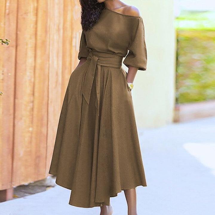 Robe femme en coton, taille cintrée, couleur unie, style classique et élégant pour toutes occasions.