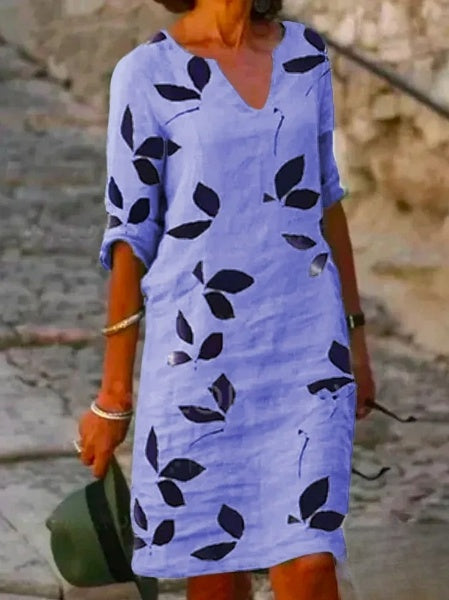 "Robe imprimée demi-manches florale, vue frontale, élégante et confortable pour femme, style moderne et féminin."