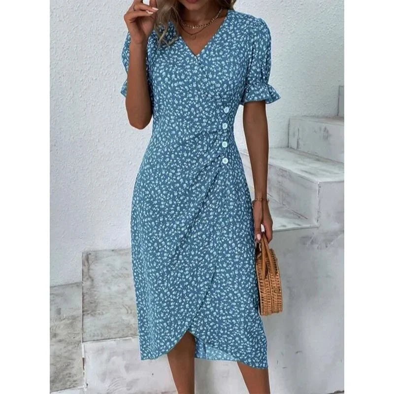 "Robe Isabelle fleurie élégante, motifs floraux colorés, manche courte, coupe ajustée féminine, idéale bureau ou soirée."