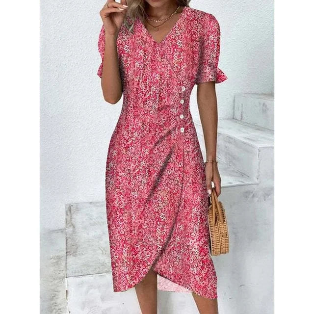 "Robe Isabelle fleurie élégante, motifs floraux colorés, manche courte, coupe ajustée féminine, idéale bureau ou soirée."