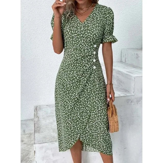 "Robe Isabelle fleurie élégante, motifs floraux colorés, manche courte, coupe ajustée féminine, idéale bureau ou soirée."