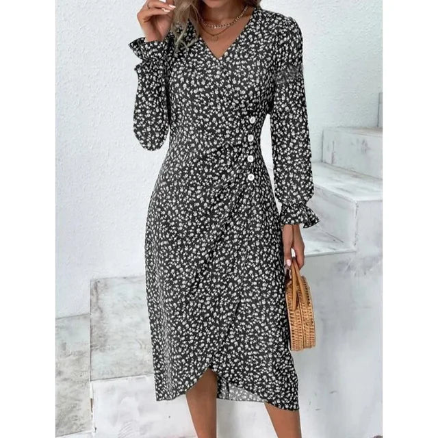 "Robe Isabelle fleurie élégante, motifs floraux colorés, manche courte, coupe ajustée féminine, idéale bureau ou soirée."