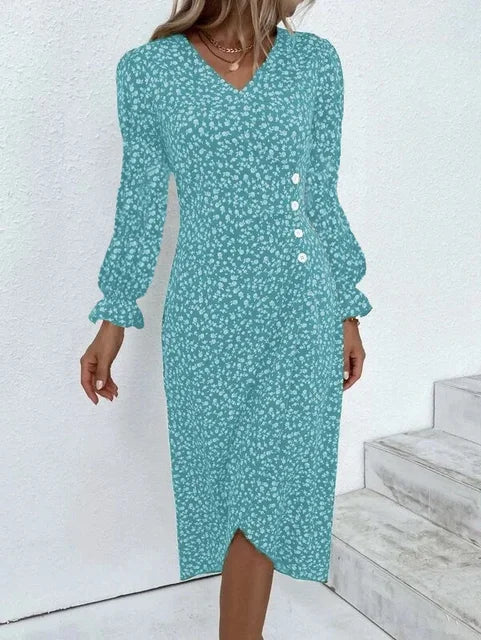 "Robe Isabelle fleurie élégante, motifs floraux colorés, manche courte, coupe ajustée féminine, idéale bureau ou soirée."