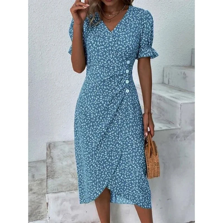 "Robe Isabelle fleurie élégante, motifs floraux colorés, manche courte, coupe ajustée féminine, idéale bureau ou soirée."
