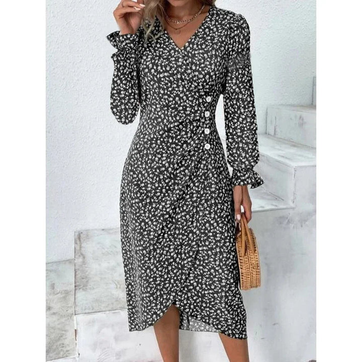 "Robe Isabelle fleurie élégante, motifs floraux colorés, manche courte, coupe ajustée féminine, idéale bureau ou soirée."