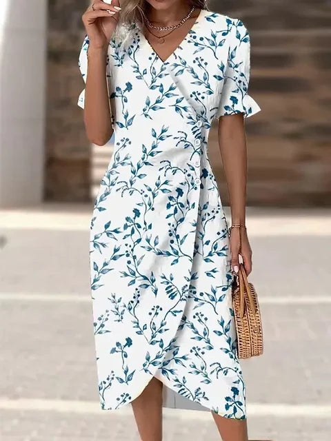 "Robe Isabelle fleurie élégante, motifs floraux colorés, manche courte, coupe ajustée féminine, idéale bureau ou soirée."