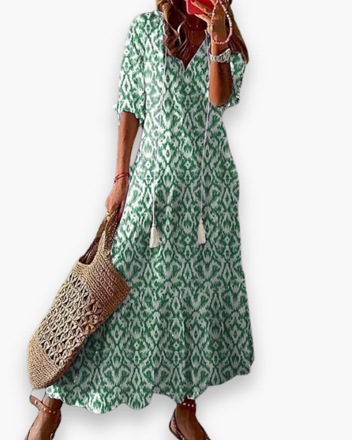 "Robe longue bohème femme, imprimé floral, élégante et fluide pour l'été, coupe ample, style romantique décontracté."
