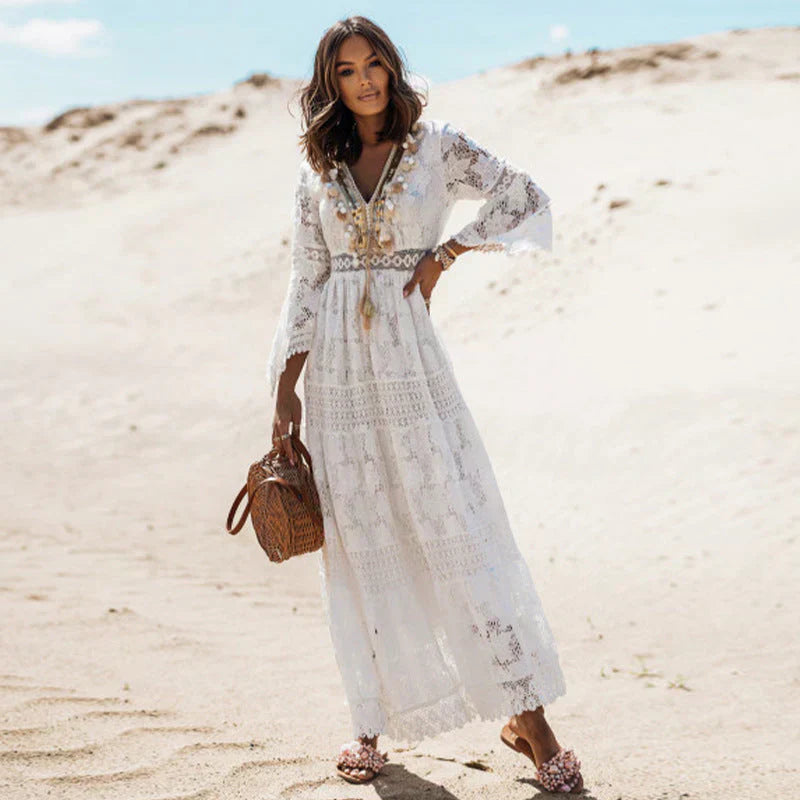 "Robe longue bohème fluide avec manches et motifs artistiques, élégante pour une sortie estivale ou moments de détente."
