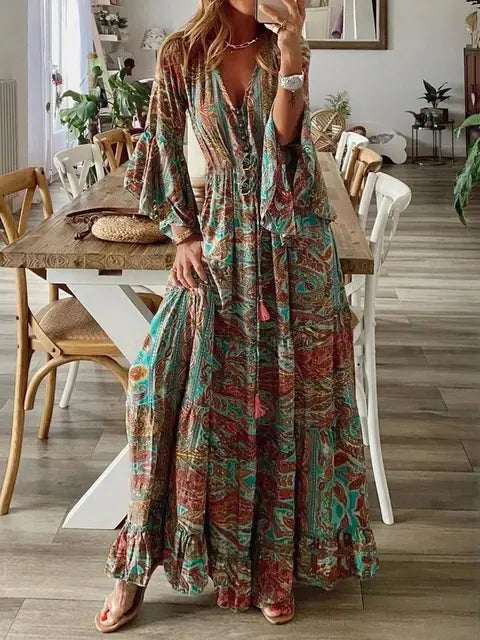 "Robe longue bohémienne chic d'été, manches évasées, motifs floraux, taille haute flatteuse, col en V élégant."