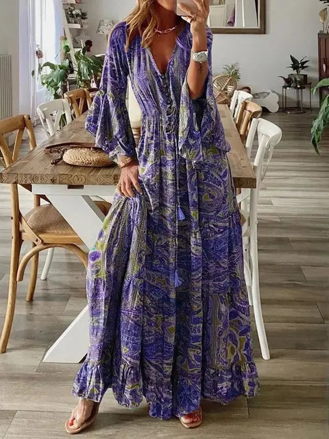 "Robe longue bohémienne chic d'été, manches évasées, motifs floraux, taille haute flatteuse, col en V élégant."