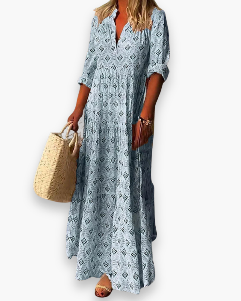 Robe longue boho chic femme à motif floral, coupe fluide, tissu léger, col V pour une élégance estivale décontractée.
