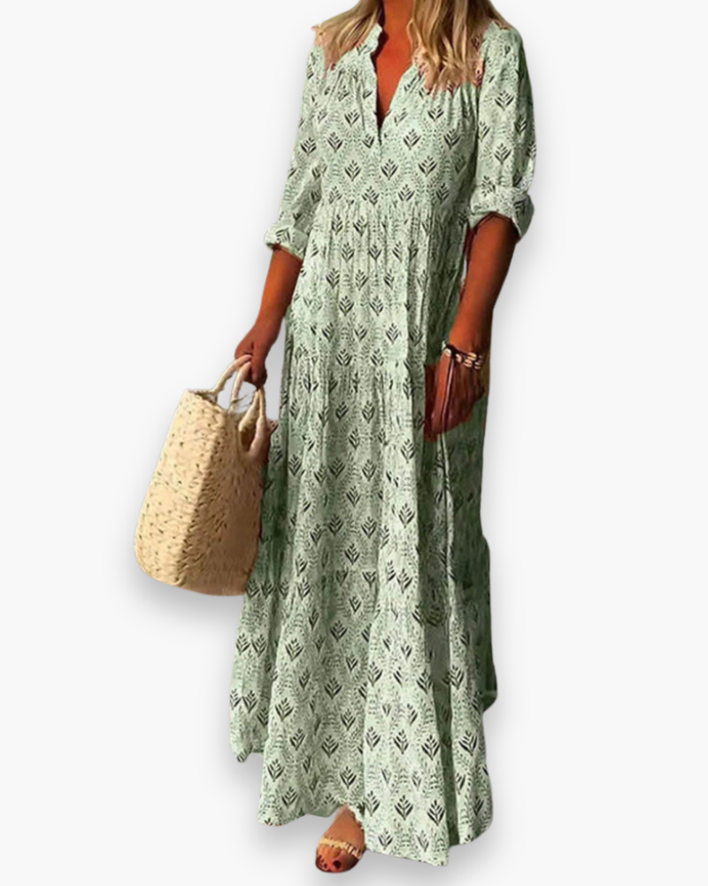 Robe longue boho chic femme à motif floral, coupe fluide, tissu léger, col V pour une élégance estivale décontractée.