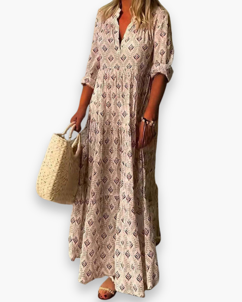 Robe longue boho chic femme à motif floral, coupe fluide, tissu léger, col V pour une élégance estivale décontractée.