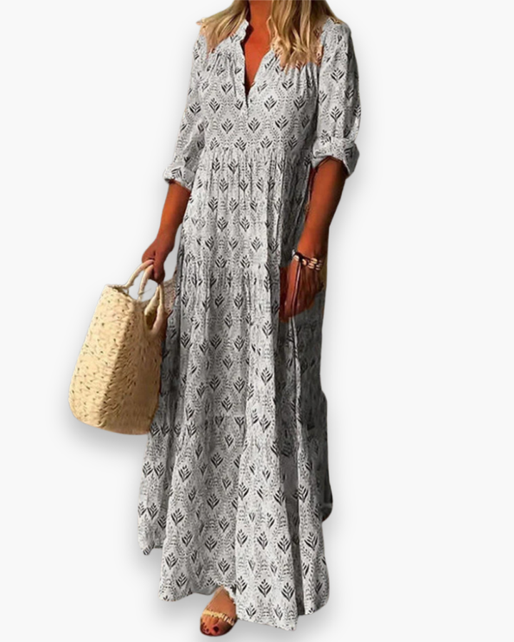 Robe longue boho chic femme à motif floral, coupe fluide, tissu léger, col V pour une élégance estivale décontractée.