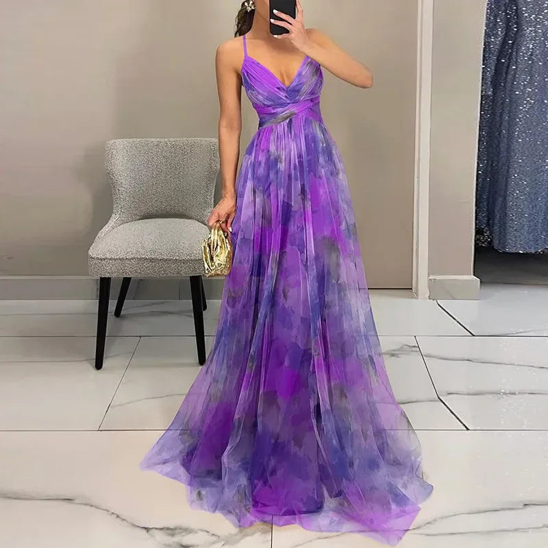 "Robe longue d'été, motif floral vibrant, coupe fluide, ajustable, idéale pour journées chaudes et événements variés."
