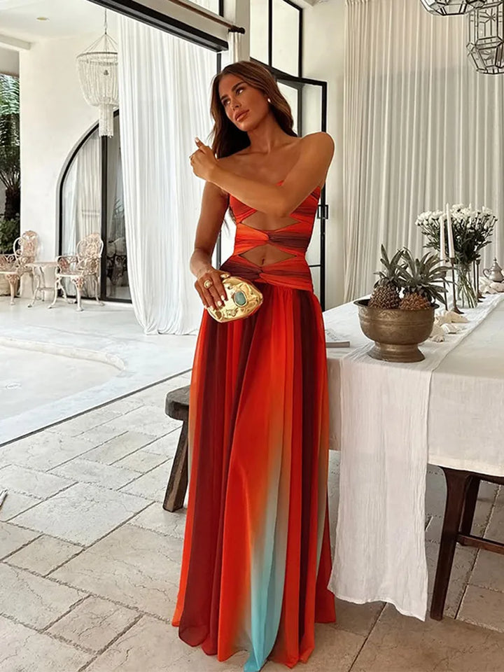 "Robe longue Maya Sunset élégante avec dégradé vibrant inspiré des couchers de soleil, parfait pour moments inoubliables."