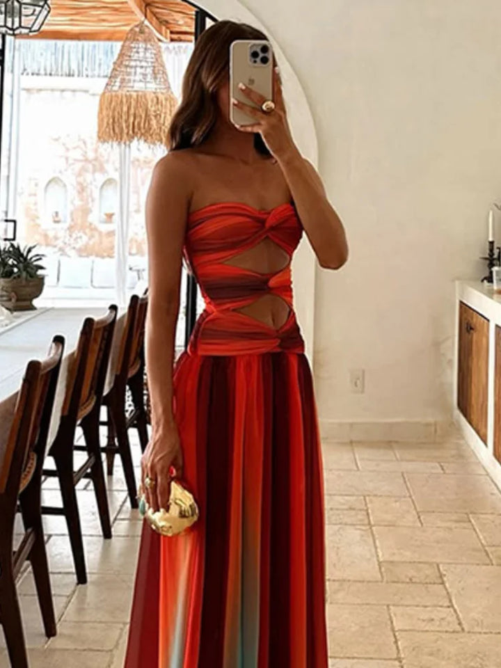 "Robe longue Maya Sunset élégante avec dégradé vibrant inspiré des couchers de soleil, parfait pour moments inoubliables."
