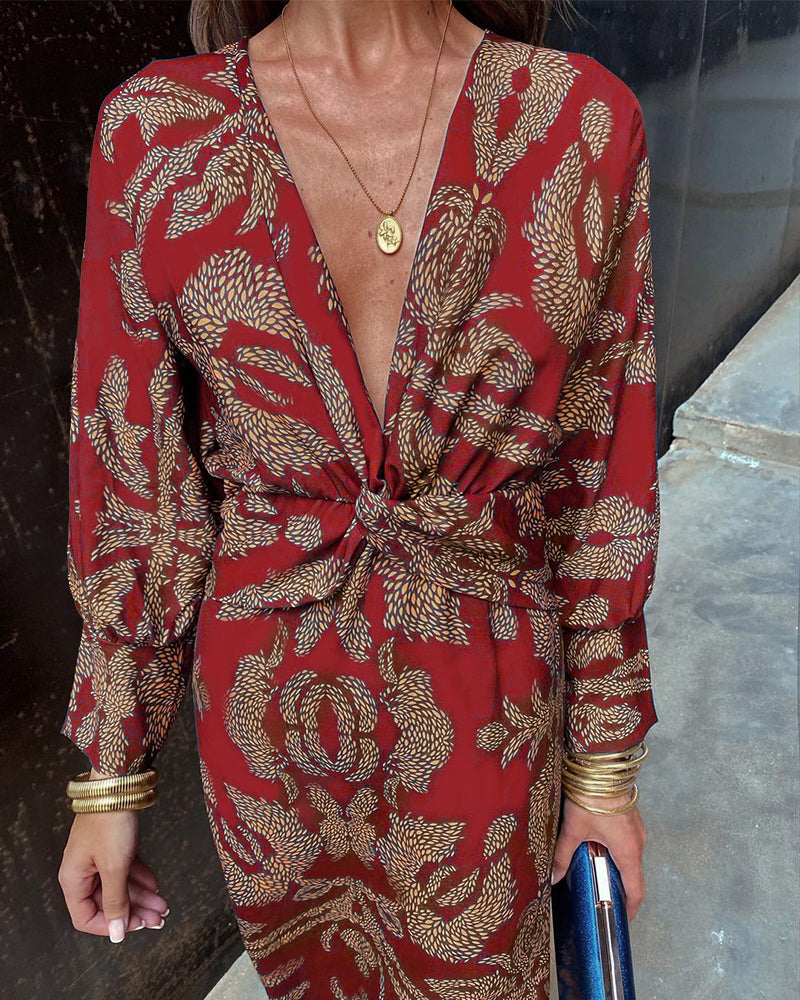 Robe maxi élégante à manches longues, décolleté V et détail twisté à la taille, idéale pour événements formels.