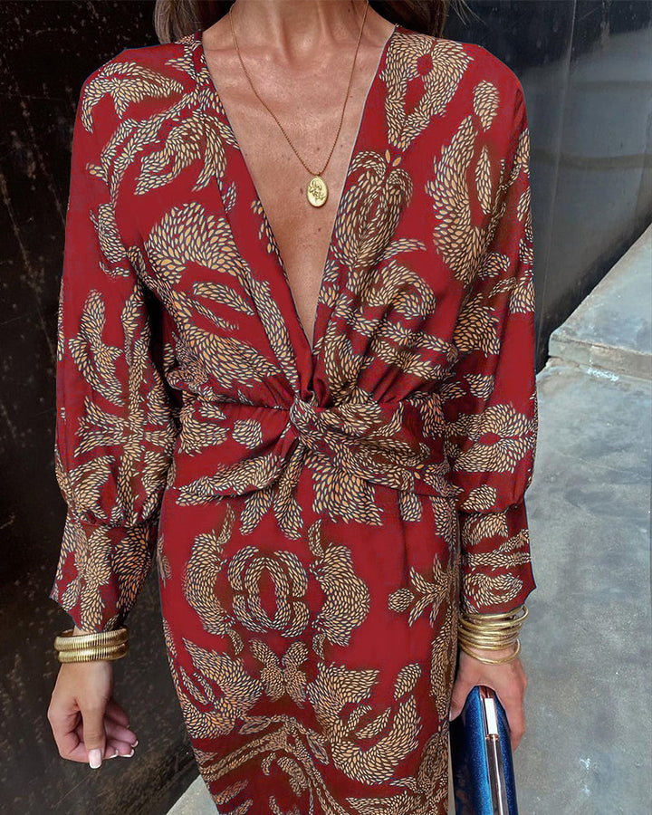 Robe maxi élégante à manches longues, décolleté V et détail twisté à la taille, idéale pour événements formels.