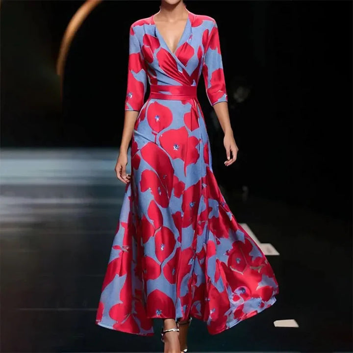 "Robe maxi longue élégante à imprimé floral vibrant, col en V et manches trois-quarts, tissu léger et respirant."