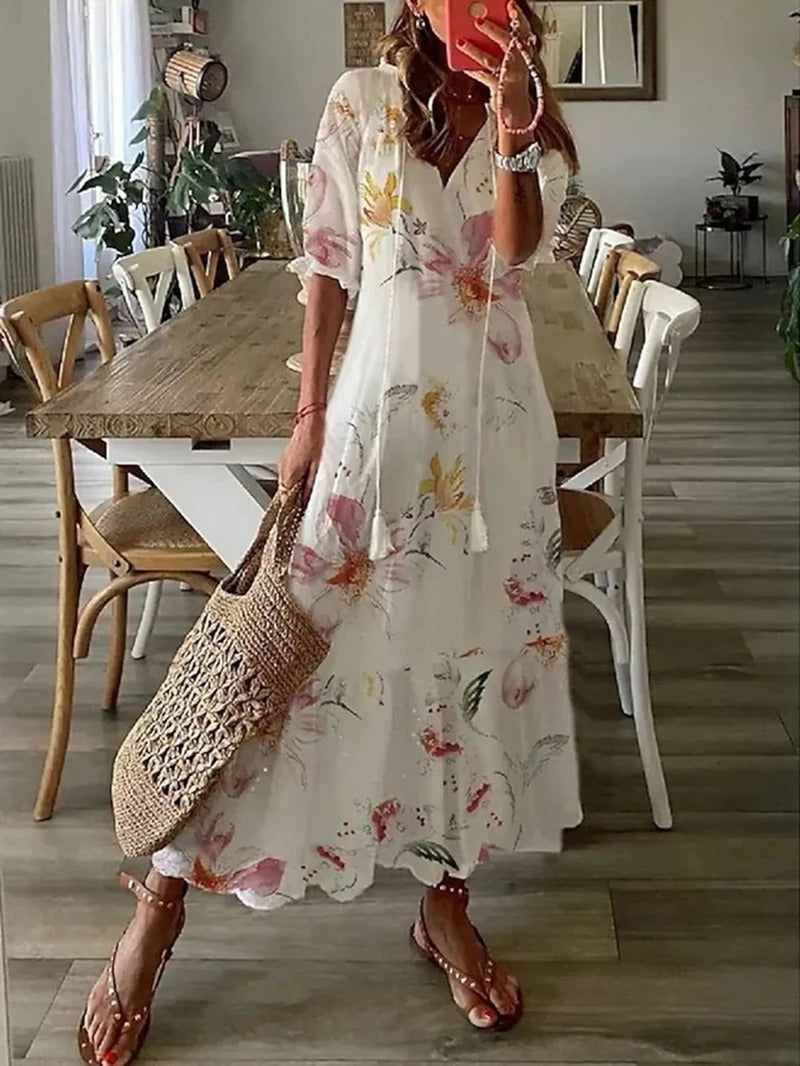 "Robe maxi vert bohème fluide, motifs élégants entrelacés, style chic et confortable, longueur au sol, tissu léger."