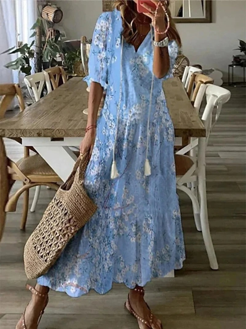 "Robe maxi vert bohème fluide, motifs élégants entrelacés, style chic et confortable, longueur au sol, tissu léger."