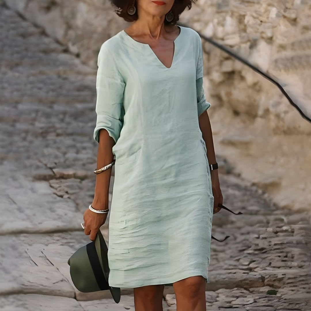 Robe midi d'été colorée, chic et légère, avec jupe évasée et tissu respirant, pour un style estival élégant et confortable.