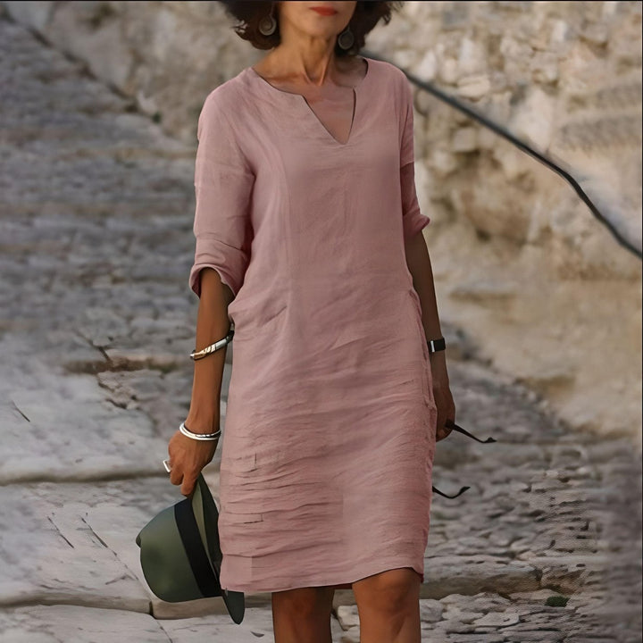 Robe midi d'été colorée, chic et légère, avec jupe évasée et tissu respirant, pour un style estival élégant et confortable.