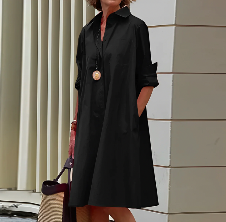"Robe midi élégante d'été en tissu léger, coupe cintrée, couleur vibrante, parfaite pour confort et style."