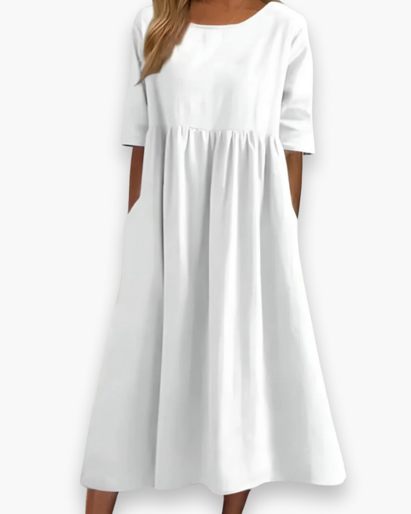 "Robe midi élégante et confortable pour femme, coupe fluide et détails soignés dans diverses couleurs disponibles."