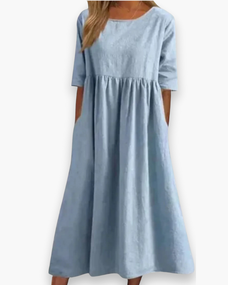 "Robe midi élégante et confortable pour femme, coupe fluide et détails soignés dans diverses couleurs disponibles."